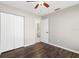 Bright bedroom with hardwood floors, closet, and ensuite bathroom doorway at 1985 Hastings Dr, Clearwater, FL 33763