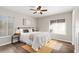 Comfortable bedroom with natural light, wood-look floors, and stylish decor at 1985 Hastings Dr, Clearwater, FL 33763