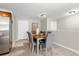 Bright dining area featuring modern decor, neutral paint, and access to the kitchen at 1985 Hastings Dr, Clearwater, FL 33763