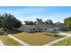 Charming single-Gathering home with a manicured lawn, lush landscaping and an attached two-car garage at 1985 Hastings Dr, Clearwater, FL 33763