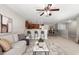 Inviting open-plan living area with kitchen bar, dining space, and comfortable seating arrangement at 1985 Hastings Dr, Clearwater, FL 33763