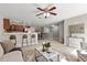 Spacious open-concept living space with bar seating, dining area, and modern fixtures at 1985 Hastings Dr, Clearwater, FL 33763