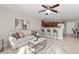 Open-concept living space with kitchen access, bar seating, and ample natural light at 1985 Hastings Dr, Clearwater, FL 33763