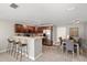 Open floor plan with bar seating and dining area, perfect for entertaining guests at 1985 Hastings Dr, Clearwater, FL 33763