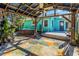 Charming backyard patio with a pergola, perfect for relaxing next to the hot tub at 2016 Douglas Ave, Clearwater, FL 33755