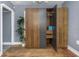 Bedroom with modern wardrobe, hardwood floors, and neutral wall paint at 2016 Douglas Ave, Clearwater, FL 33755
