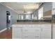 Updated kitchen featuring drawers, counter seating, and a view into the living and dining areas at 2016 Douglas Ave, Clearwater, FL 33755