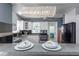 Modern kitchen with white cabinets, stainless steel appliances, and a stylish countertop with two bowls and napkins at 2016 Douglas Ave, Clearwater, FL 33755