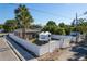 An aerial view shows the property's covered outdoor area and RV parking behind a privacy fence at 212 28Th S St, St Petersburg, FL 33712