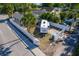 An aerial view showcases a home with RV parking in a fenced yard surrounded by lush greenery at 212 28Th S St, St Petersburg, FL 33712