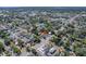 This aerial view shows the neighborhood streets, residential houses and mature tree coverage at 212 28Th S St, St Petersburg, FL 33712