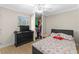 Bedroom featuring a ceiling fan, closet, dresser, and a double bed at 212 28Th S St, St Petersburg, FL 33712
