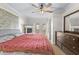 Spacious bedroom with fireplace, ceiling fan, wood floors, and french doors to outdoor patio at 212 28Th S St, St Petersburg, FL 33712