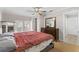Bright bedroom with hardwood floors, ceiling fan, dresser, closet and french doors to patio at 212 28Th S St, St Petersburg, FL 33712