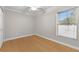 Minimalist bedroom with hardwood floors, single window, and a large double door closet at 212 28Th S St, St Petersburg, FL 33712