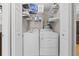 Laundry closet with shelving, washer, and dryer in a bright area at 212 28Th S St, St Petersburg, FL 33712