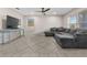 Spacious living room with tile floors, a ceiling fan, and ample natural light at 212 28Th S St, St Petersburg, FL 33712