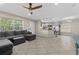 Open-concept living space with tile flooring connecting the living room and kitchen at 212 28Th S St, St Petersburg, FL 33712