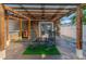 Inviting covered patio featuring an outdoor kitchen and ceiling fan, ideal for relaxing and entertaining guests at 212 28Th S St, St Petersburg, FL 33712