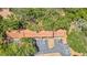 Aerial view of a multi-unit residential building with a parking lot and surrounded by lush trees at 2122 Bradford St # 505, Clearwater, FL 33760