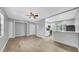 Open living space with wood-look floors flowing into the adjacent kitchen area at 2122 Bradford St # 505, Clearwater, FL 33760