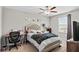 This bedroom features a ceiling fan, an accent wall, and plenty of natural light at 21383 Southern Charm Dr, Land O Lakes, FL 34637