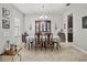 Bright dining room with tile floors, decorative chandelier, and a classic china cabinet for storage at 21383 Southern Charm Dr, Land O Lakes, FL 34637
