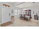 Formal dining room with tile flooring, stylish furniture, and elegant decor for entertaining guests at 21383 Southern Charm Dr, Land O Lakes, FL 34637