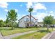 Attractive two-story house with a large front lawn and mature trees in a quiet neighborhood at 21383 Southern Charm Dr, Land O Lakes, FL 34637