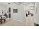 Hallway with views of the dining room, kitchen, and living area at 21383 Southern Charm Dr, Land O Lakes, FL 34637