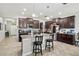 Bright kitchen features a center island, granite countertops, and stainless appliances at 21383 Southern Charm Dr, Land O Lakes, FL 34637
