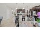 Open kitchen with granite countertops, dark wood cabinets and a breakfast bar at 21383 Southern Charm Dr, Land O Lakes, FL 34637
