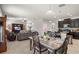 Open-concept living and dining area, transitioning to the kitchen at 21383 Southern Charm Dr, Land O Lakes, FL 34637