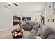 Open-concept living room seamlessly connects to the modern kitchen, perfect for entertaining guests at 21383 Southern Charm Dr, Land O Lakes, FL 34637