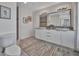 Bathroom featuring double sinks with a large mirror and a walk in shower at 226 5Th N Ave # 605, St Petersburg, FL 33701