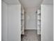 Spacious walk-in closet with built in shelving and plush carpet at 226 5Th N Ave # 605, St Petersburg, FL 33701