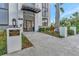 Building entrance with landscaped accents, modern architectural details, and clear signage at 226 5Th N Ave # 605, St Petersburg, FL 33701