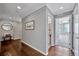 Inviting hallway features hardwood floors and leads to the bathroom and main bedroom at 226 5Th N Ave # 605, St Petersburg, FL 33701