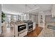 Stylish kitchen with granite countertops and modern appliances, open to dining and living area at 226 5Th N Ave # 605, St Petersburg, FL 33701