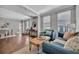 Bright living room featuring hardwood floors, a blue sofa, natural light, and neutral paint at 226 5Th N Ave # 605, St Petersburg, FL 33701
