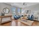 Inviting living room features neutral walls, wood floors, and city views from the large windows at 226 5Th N Ave # 605, St Petersburg, FL 33701