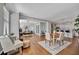 Spacious open-concept with hardwood flooring includes dining and living area with modern furnishings at 226 5Th N Ave # 605, St Petersburg, FL 33701