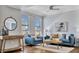 Living room features hardwood floors, city views from the windows, and comfortable furniture at 226 5Th N Ave # 605, St Petersburg, FL 33701