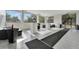 Indoor lounge area with tiled floors, cushioned seats, outdoor views, and a tranquil setting at 226 5Th N Ave # 605, St Petersburg, FL 33701