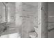 Modern bathroom features beautiful marble tiling, sleek fixtures, and a glass-enclosed shower at 2275 62Nd N Ave # 5202, St Petersburg, FL 33702