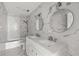 Updated bathroom featuring double sinks, modern fixtures, and marble tile at 2275 62Nd N Ave # 5202, St Petersburg, FL 33702
