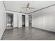 Spacious bedroom featuring tile floors, closet, and an ensuite bathroom at 2275 62Nd N Ave # 5202, St Petersburg, FL 33702