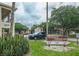 Condominium complex featuring well-manicured landscaping and signage for 'Chateaux Versailles Condominiums' at 2275 62Nd N Ave # 5202, St Petersburg, FL 33702