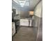 Updated kitchen with stainless steel appliances, granite countertops, and modern lighting at 2275 62Nd N Ave # 5202, St Petersburg, FL 33702