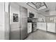 Modern kitchen with stainless steel appliances, white cabinets, and updated countertops at 2275 62Nd N Ave # 5202, St Petersburg, FL 33702
